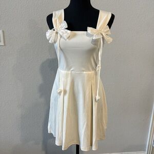 Elegant Cream Dress with Bow Accents